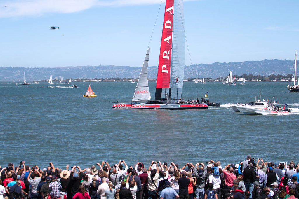 Luna Rossa passes by the crowds on shore. - America's Cup © Chuck Lantz http://www.ChuckLantz.com